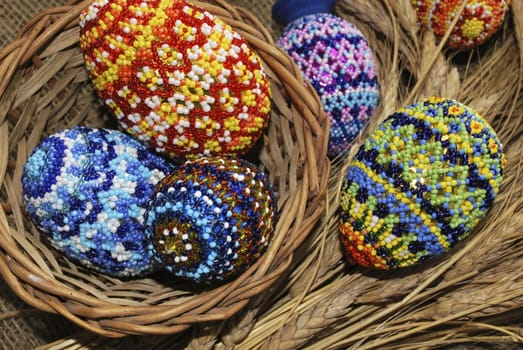 Easter eggs from beads and basket from dry stalk