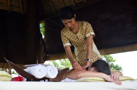 White woman on massage in Bali salon