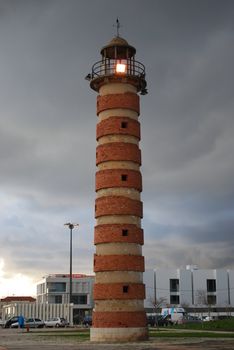 antique lighthouse with red bricks