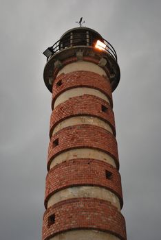 antique lighthouse with red bricks