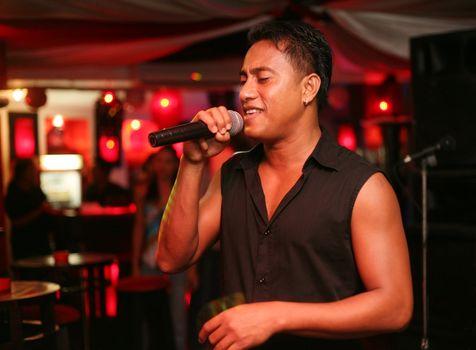 Singer at an alive concert in a night club "La vida loka". Bali. Indonesia