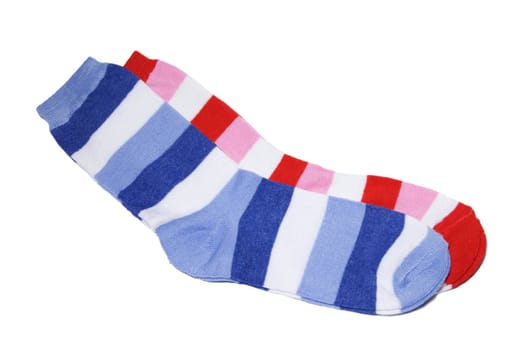 Two pairs children's striped socks of bright red and dark blue colour on a white background. Clipping path, excluding shadow.