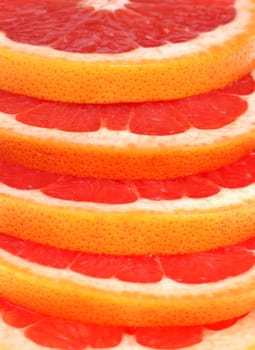 Cut grapefruit slice on white