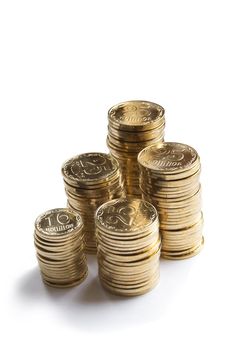 Brilliant coins of yellow colour 25 and 10 on a white background with the bottom shade.