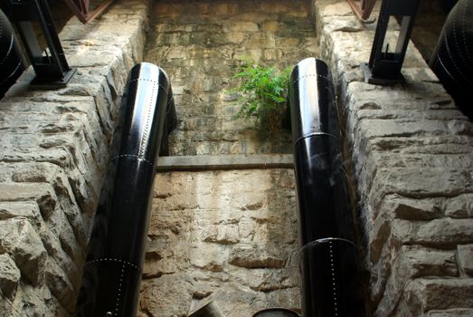 Antique hydro electric water intake pipes at a pre 1900's power station.