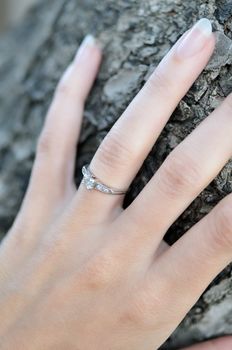 Close-up of a diamond engagement ring.  Selective focus is used.