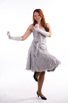 Young girl with white gloves standing on white background
