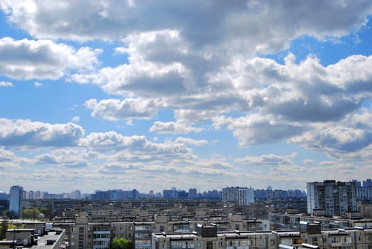 thousand of roofs against cloud sky background