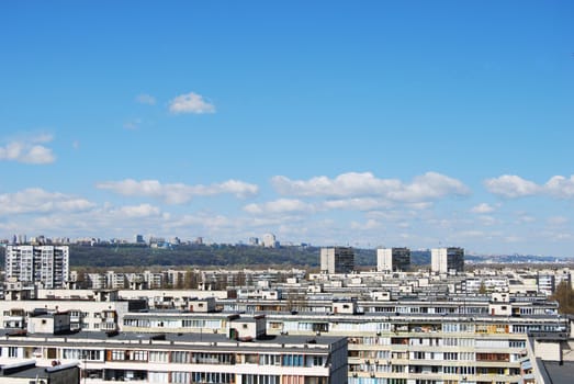 thousand of roofs against cloud sky background