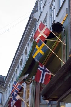 Danish and Swedish flags on facade in Copenhagen