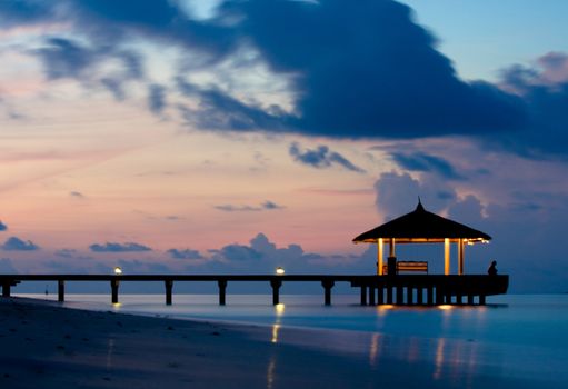 Bridge silhouette and tranquil ocean in the twilight