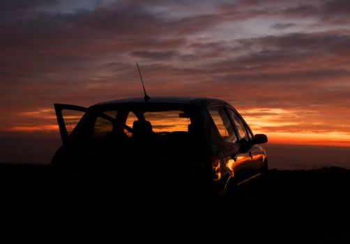 car silhouette in the sunset