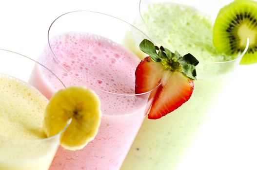 Assorted fruit smoothies close up on white background