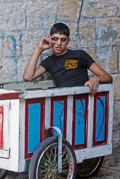 Jerusalem Israel August 2008 -   young arab boy outside in the old city market