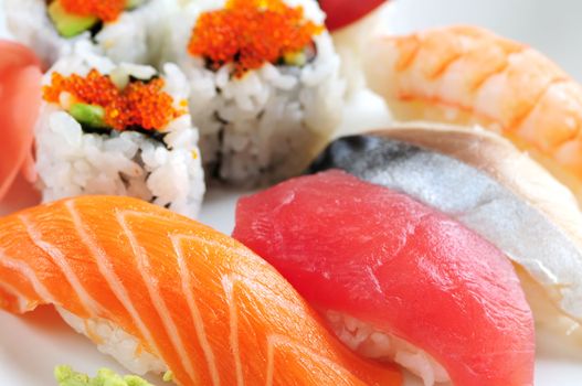 Sushi and california rolls on a plate macro