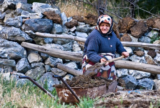 April 2008 village in Turkey - traditional old Turkish woman working outside