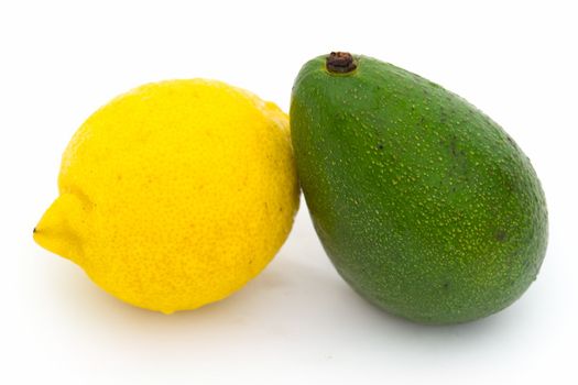 yellow lemon and green avocado on a white background