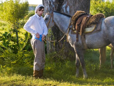 TACUAREMBO, URUGUAY - MAR 7 : Participant in the annual festival "Patria Gaucha" March 7, 2009 in Tacuarembo, Uruguay. It is one of the biggest festival in South America to celebrate gaucho culture