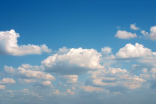 Lots of big clouds over blue sky