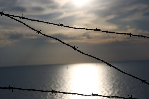 Barbed wire at the sea