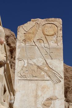 Egyptian antique sculpture in Mortuary Temple of Queen Hatshepsut (18th Dynasty) at Deir el-Bahri, Luxor, Egypt.