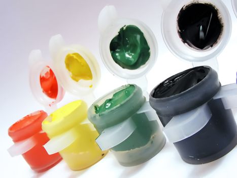Model paint containers open to expose the rich, vibrant acrylic paint.