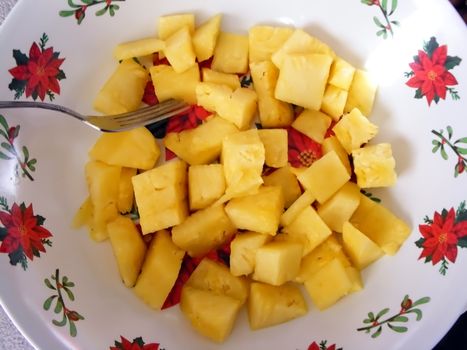 Chunks of pineapple served for hungry guests during the Christmas season.