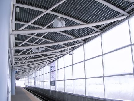 Waiting at a rail station during a winter snow storm.