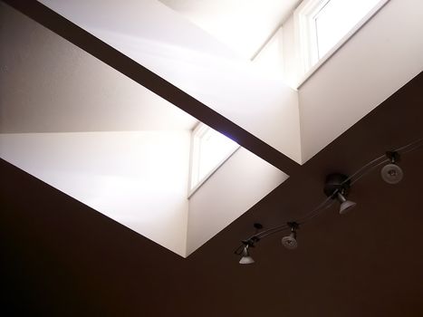 Sunlight streaming in through living room skylight in modern home.