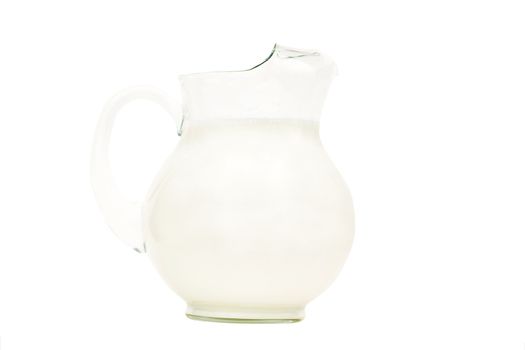 Glass pitcher of milk isolated on white