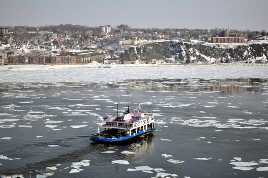 Transportation: Ferry boat crossing river in winter