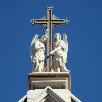 cross and figures on the roof of Santa Croce church in FlorenceTuscanyItalyneo-gothic facade