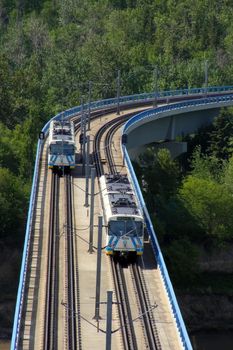 Light rail transit tracks and bridge over river.