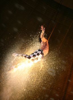 air acrobat carry out exercise on a circus