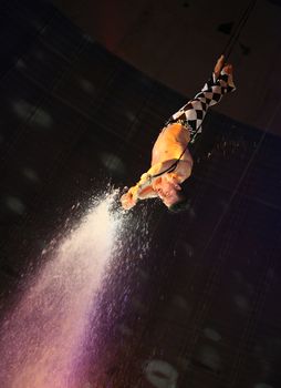 air acrobat carry out exercise on a circus