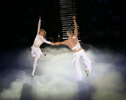	Two air acrobats carry out exercise on a circus ring
