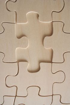 Wooden jigsaw pattern with one empty space