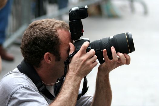Professional reporter taking pictures