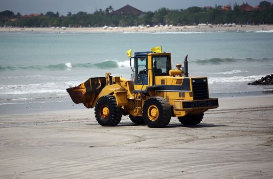 A view of a big bulldozer on coastline