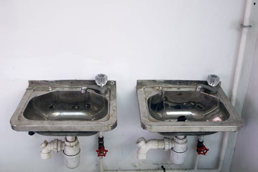 Two old sinks stands abandoned at a ferry terminal in Hong Kong