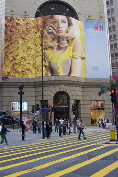 A H&M (Hennes & Mauritz) billboard in the commercial center of Hong Kong Island. H&M opened it first stores in Hong Kong on March 10th 2007, and has seen a big demand for it's clothes ever since.