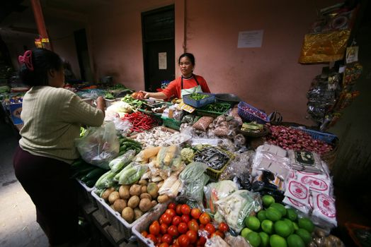 Indonesia. Bali. The woman sells the goods