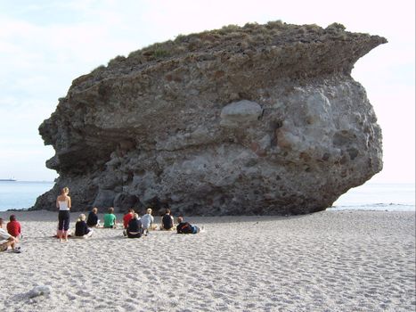 big stone and people studying