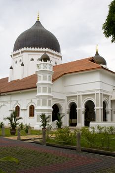 The famous Kapitan Kling Mosque in Georgetown, Malaysia. This is one of the oldest  Mosques in the area, and a famous place for locals as well as tourists. 
