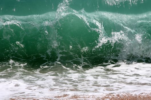 Big wave crashes on to the shore
