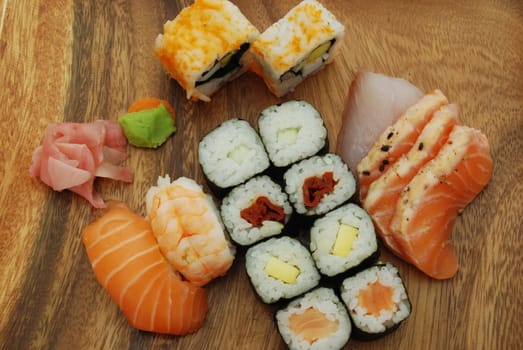 high quality photo of sushi meal (uramaki california, hossomaki, nigiri, sashimi)