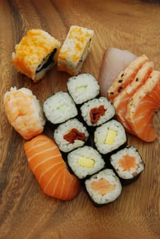 high quality photo of sushi meal (uramaki california, hossomaki, nigiri, sashimi)