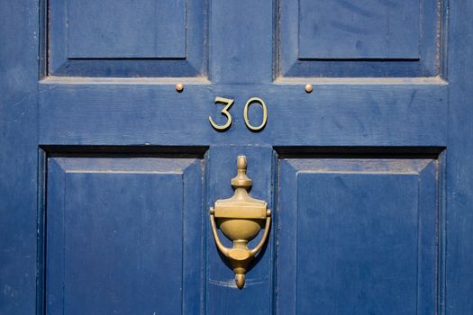 Closeup of a blue door of a traditional UK house