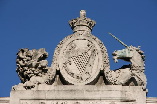 The Lion and The Unicorn - time-honoured symbols of the United Kingdom. The lion stands for England and the unicorn for Scotland. The statues are located on Customs House in Dublin, Ireland, so in the middle is national Irish Coat of Arms.