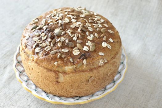 A loaf of bread with seeds on the plate